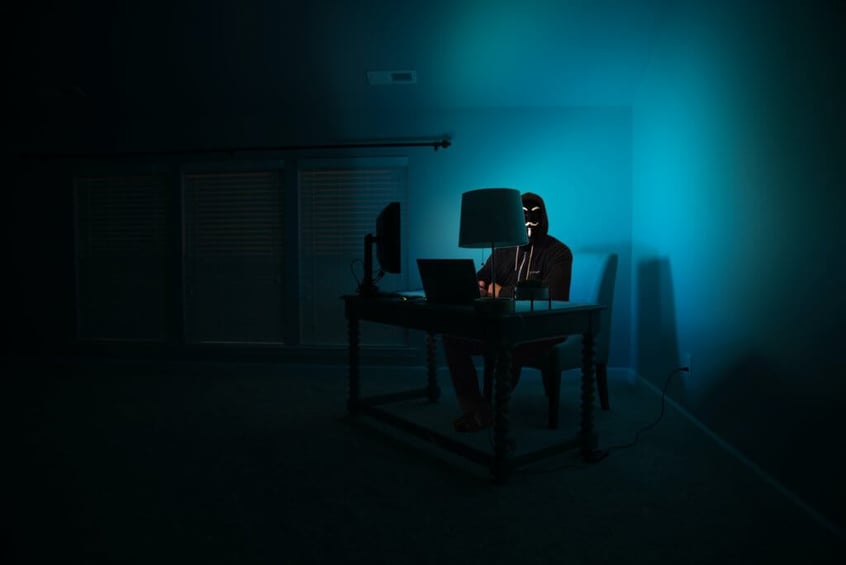 hacker in the corner exploiting vulnerabilities